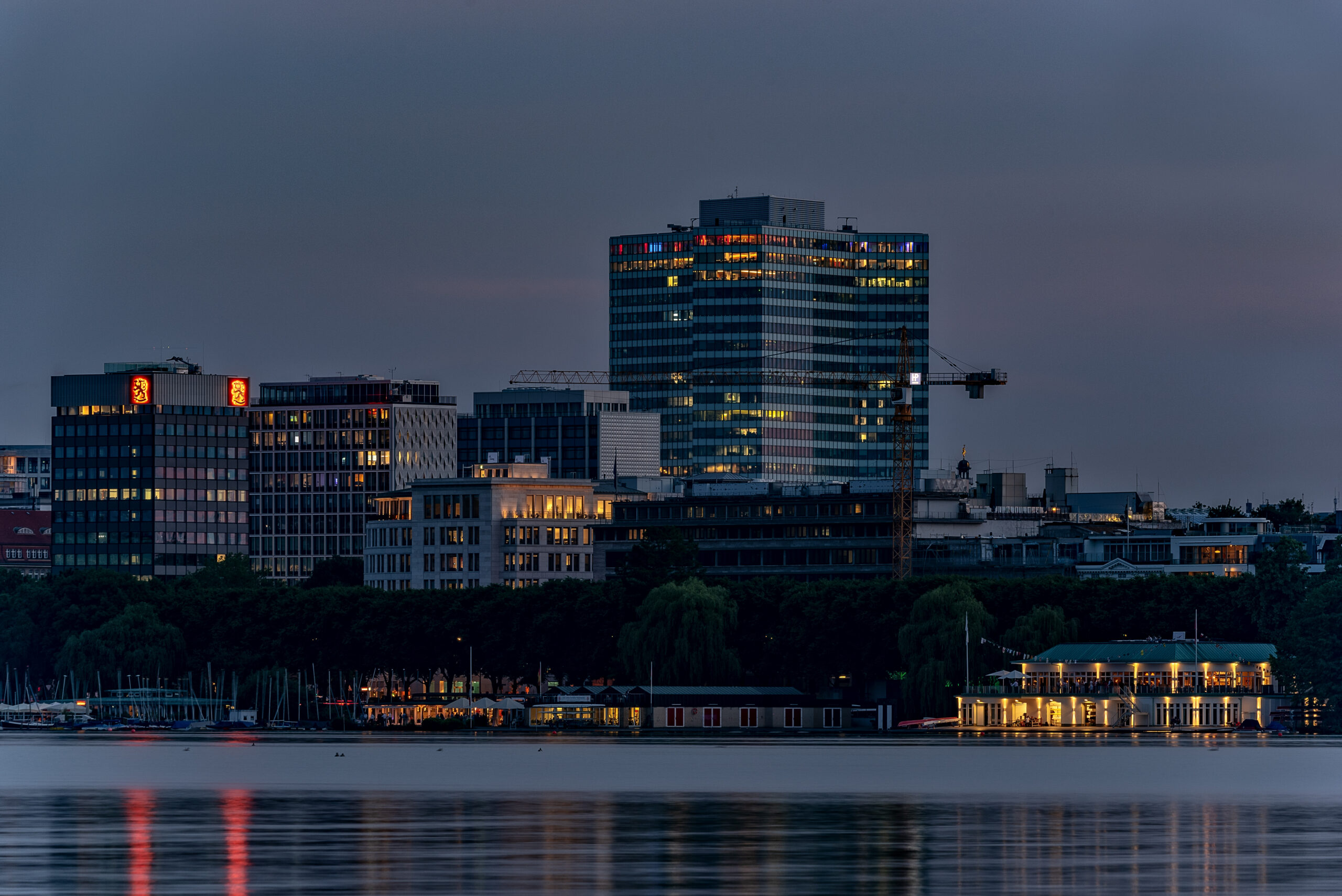 https://goldberginvestments.co.uk/wp-content/uploads/2026/07/illuminated-buildings-by-river-against-sky-dusk-scaled.jpg